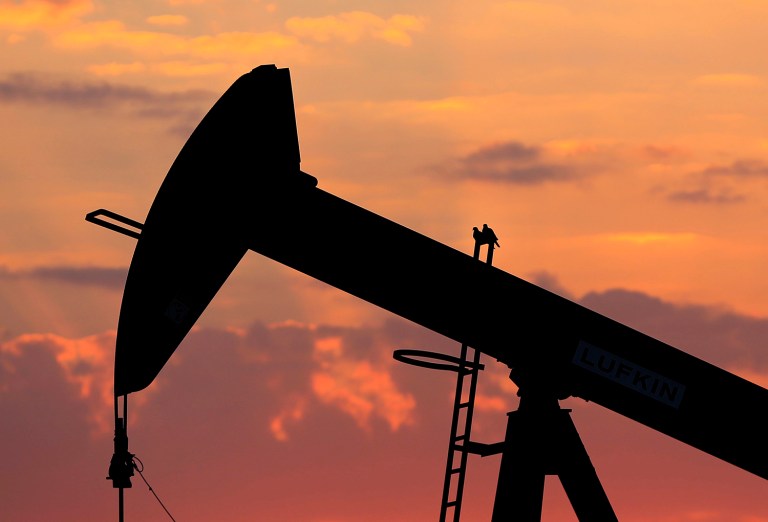 Oil prices are expected to dip at the beginning of the next president's term, but then rise from there. (AP Photo/Hasan Jamali)