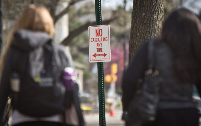 An official-looking street sign declaring "No Catcalling Anytime" is posted in Brooklyn's Grand Plaza area, Thursday, April 16, 2015, in New York. (AP Photo/Bebeto Matthews)