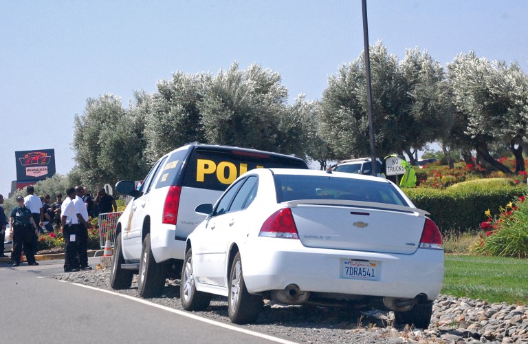 In this photo taken Monday, June 9, 2014, vehicles marked 