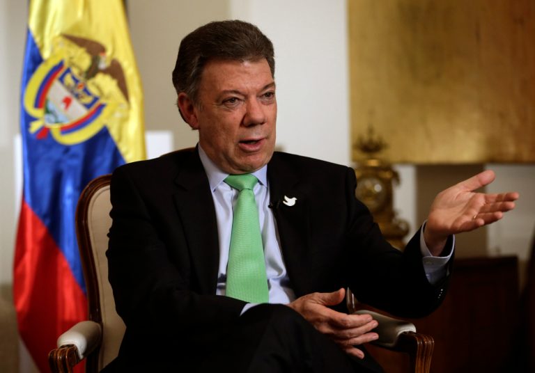 Colombian President Juan Manuel Santos talks to The Associated Press, Tuesday, Sept. 23, 2014, in New York. (AP Photo/Julio Cortez)