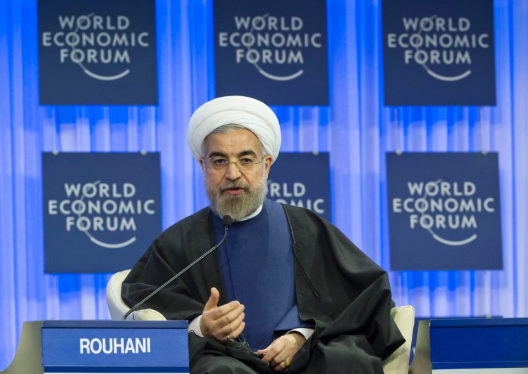 Iranian President Hassan Rouhani gestures as speaks during a session of the World Economic Forum in Davos, Switzerland, Thursday, Jan. 23, 2014. Leaders gathered in the Swiss ski resort of Davos have made it a top priority to push to reshape the global economy and cut global warming by shifting to cleaner energy sources. (AP Photo/Michel Euler)