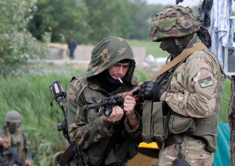Ukrainian soldiers prepare their weapons at a position in Slovyansk, Ukraine, Saturday, May 31, 2014. The Ukrainian Acting Defense Minister said on Friday that troops had ousted separatists from southern and western parts of the Donetsk region and north of the Luhansk region. (AP Photo/Efrem Lukatsky)