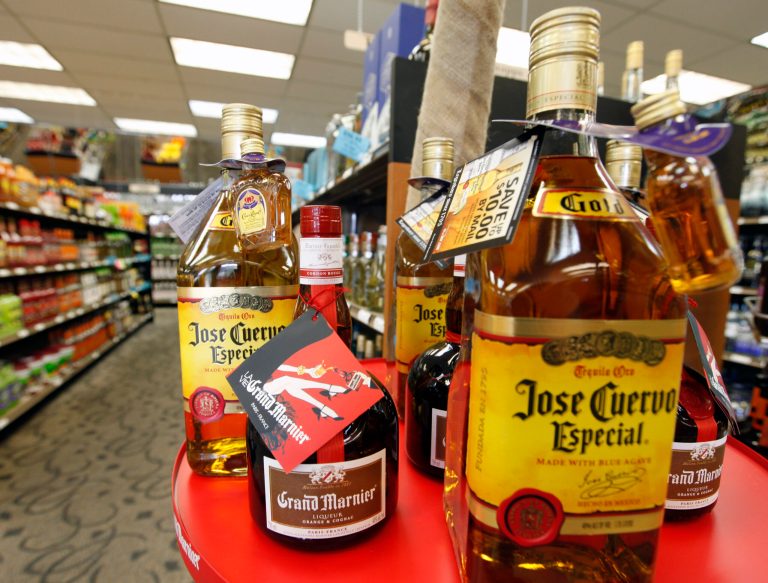 FILE-This April 15, 2010 file photo shows a liquor display at an ABC store in Richmond, Va.  As part of a plan to close a $2.4 billion budget gap, Gov. Terry McAuliffe has directed the Department of Alcoholic Beverage Control to hike the costs of liquor at its 350 stores. (AP Photo/Steve Helber)