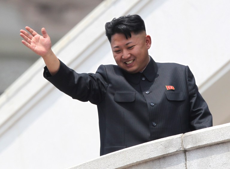 In this Saturday, July 27, 2013 photo, North Korean leader Kim Jong Un waves to war veterans during a mass military parade celebrating the 60th anniversary of the Korean War armistice in Pyongyang, North Korea. A Malaysian university faced public criticism Thursday for awarding an honorary doctorate in economics to North Korean leader Kim Jong Un, whose country is among the poorest in the world. (AP Photo/Wong Maye-E)