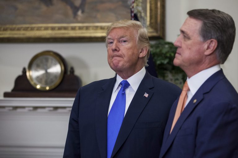 Sen. David Perdue's unwavering loyalty to President Trump in the face of controversy has also earned him the trust of a president who has rejected many of his colleagues and much of the political framework in which Perdue operates. (Zach Gibson/Bloomberg)