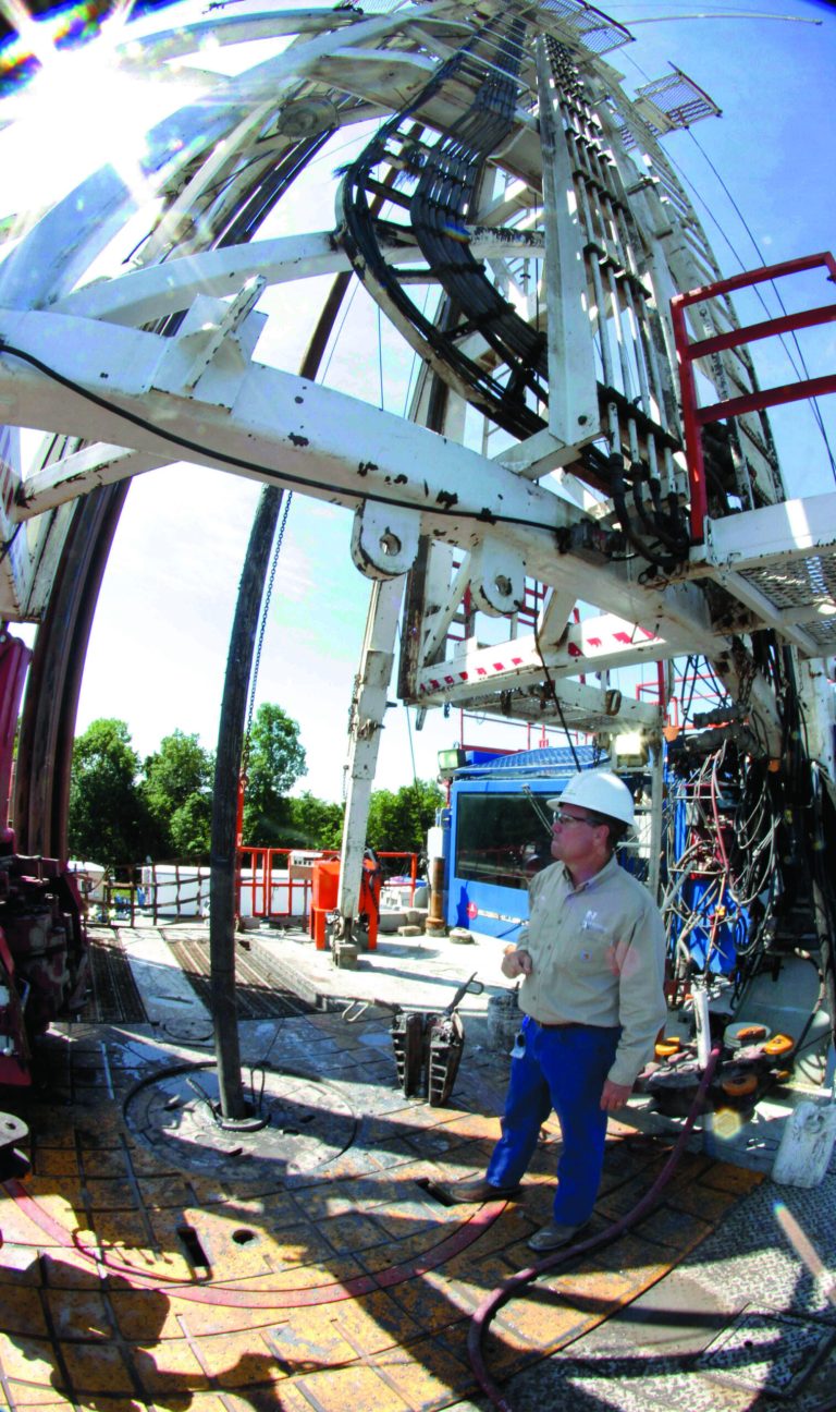 FILE - In this July 27, 2011 file photo, Range Resources site manager Don Robinson stands near the well head by the drill that goes into the shale at a well site in Washington, Pa. Energy companies and environmental groups are both wondering how President Barack Obama's reelection will impact the boom in shale natural gas drilling. (AP Photo/Keith Srakocic, File)