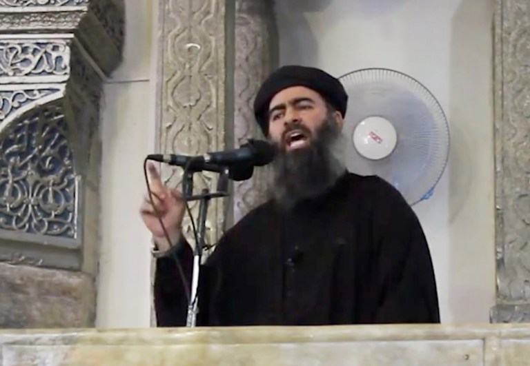 FILE - This Saturday, July 5, 2014 file image made from video posted on a militant website, which has been authenticated based on its contents and other AP reporting, purports to show the leader of the Islamic State group, Abu Bakr al-Baghdadi, delivering a sermon at a mosque in Iraq. The Islamic State group will likely take center stage when more than 140 heads of state of government convene for the U.N. General Assembly the week of Sept. 22. (AP Photo/File)