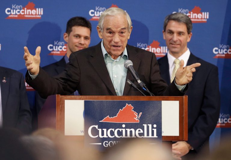 Republican gubernatorial candidate, Virginia Attorney General Ken Cuccinelli, right, listens to former U.S. Rep. Ron Paul, center, during a rally in Richmond, Va., Monday, Nov. 4, 2013. Cuccinelli faces Democrat Terry McAuliffe in Tuesday's election. (AP/Steve Helber)