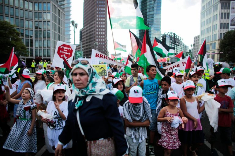 Children shout slogans during a demonstration, most of them women and children, against Israel's military offensive in Gaza, Tuesday, July 22, 2014, in Berlin, Germany. Several hundred pro-Palestinian protesters demanded a halt to military action in Gaza. (AP Photo/Markus Schreiber)