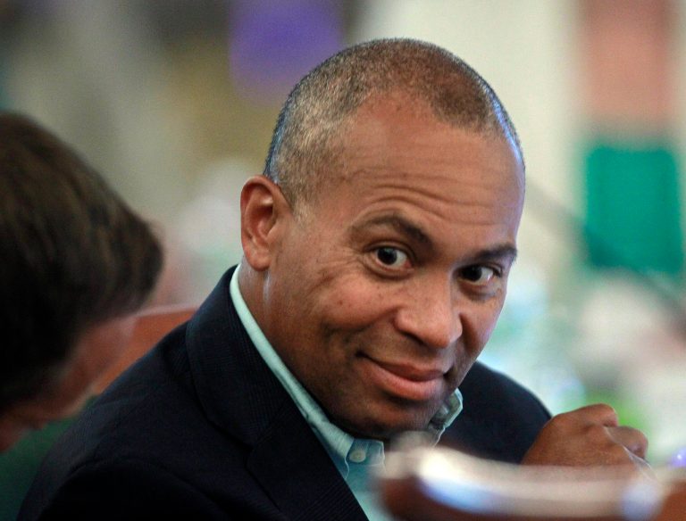 FILE - In this July 14, 2014 file photo, Massachusetts Gov. Deval Patrick talks with his staff at the New England Governors and eastern Canadian Premiers 38th annual conference in Bretton Woods, N.H. As he nears the end of his second term, Patrick has embarked on a trip around the globe, stopping in such far-flung places as Columbia, Ireland, Canada, Japan, Hong Kong, Singapore, Panama, Mexico, Israel and the United Arab Emirates. (AP Photo/Jim Cole, File)