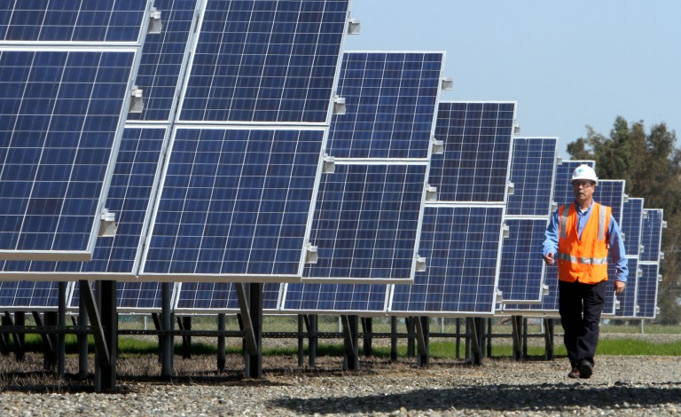 Inverter boxes that regulate power being sent from solar panels to the grid malfunctioned as a wildfire raged around transmission lines, investigation found. (AP Photo/Rich Pedroncelli)
