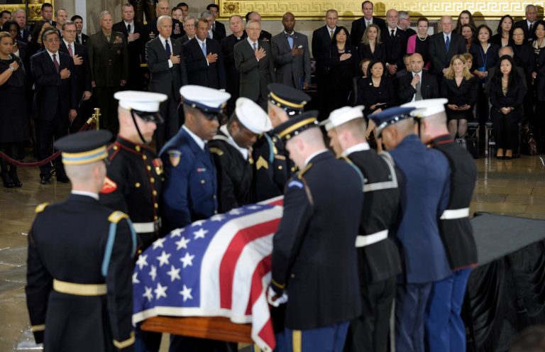   Members of Congress, staff and family, watch as the casket of Sen. Daniel Inouye, D-Hawaii, the second-longest-serving senator in history, is carried into the Capitol Rotunda in Washington to lie in state, Thursday, Dec. 20, 2012. Inouye was a Medal of Honor recipient who represented his state in the U.S. House and then the Senate, where he served for five decades. He died Monday evening at age 88 of respiratory complications. (AP Photo/Susan Walsh)  