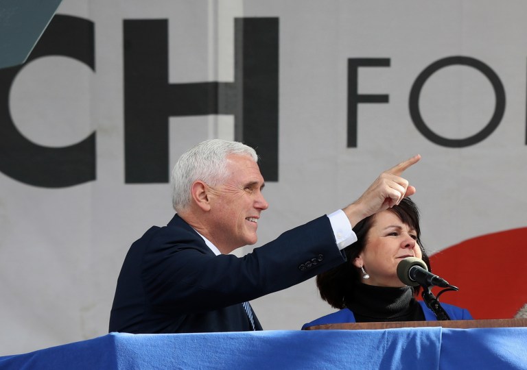 Vice President Mike Pence, left, with his wife Karen Pence, gestures toward the crowd at the March for Life on the National Mall in Washington, Friday, Jan. 27, 2017. (AP Photo/Manuel Balce Ceneta)