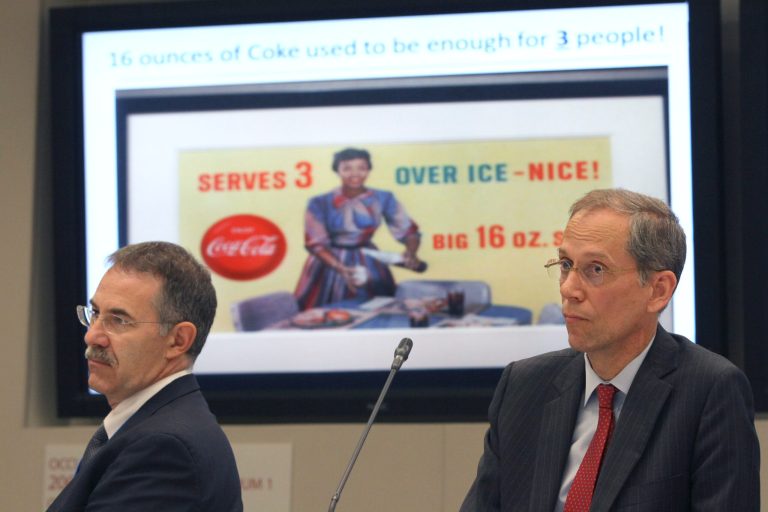   New York City Health Commissioner Thomas Farley, right, and board member Joel Forman listen to a presentation on sugary drinks during a New York City Board of Health meeting, Tuesday, June 12, 2012 in New York. Mayor Michael Bloomberg's proposal to ban large sugaryÂ drinks from New York City eateries is moving forward. The proposal was formally submitted to the city's board of health Tuesday morning. The board is expected to hold a series of public hearings during a 90-day comment period. (AP Photo/Mary Altaffer)  