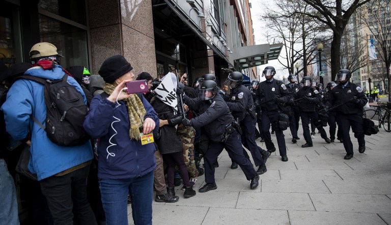 Police arrested more than 230 activists, reporters, and legal observers on Jan. 20, 2017, after a chaotic 30-minute march through downtown D.C. north of the inaugural parade route. (Eric Thayer/Bloomberg)