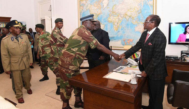 Zimbabwean President Robert Mugabe, meets with Defense Forces generals in Harare at State House , Sunday, Nov, 19, 2017. Members of the ZANU PF Central committee fired Mugabe as chief and replaced him with dismissed deputy President, Emmerson Mnangagwa on Sunday. (AP Photo)