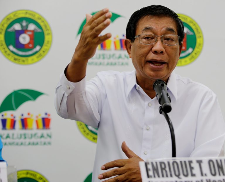 Philippine Health Secretary Enrique Ona gestures during a news conference on the  Middle East Respiratory Syndrome-Corona virus (MERS-Cov) which might affect the Muslims' pilgrimage to Mecca in Saudi Arabia known as Hajj Thursday, July 3, 2014 in Manila, Philippines. Philippine health authorities are urging Muslim Filipinos to postpone their pilgrimage to Mecca in Saudi Arabia due to worries about the Middle East respiratory syndrome virus. (AP Photo/Bullit Marquez)