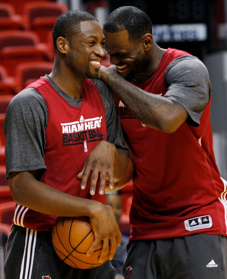   Miami Heat shooting guard Dwyane Wade, left, and small forward LeBron James share a laugh during practice, Monday, June 18, 2012, in Miami. The Heat play the Oklahoma City Thunder in Game 4 of the NBA basketball finals on Tuesday. (AP Photo/Alan Diaz)  