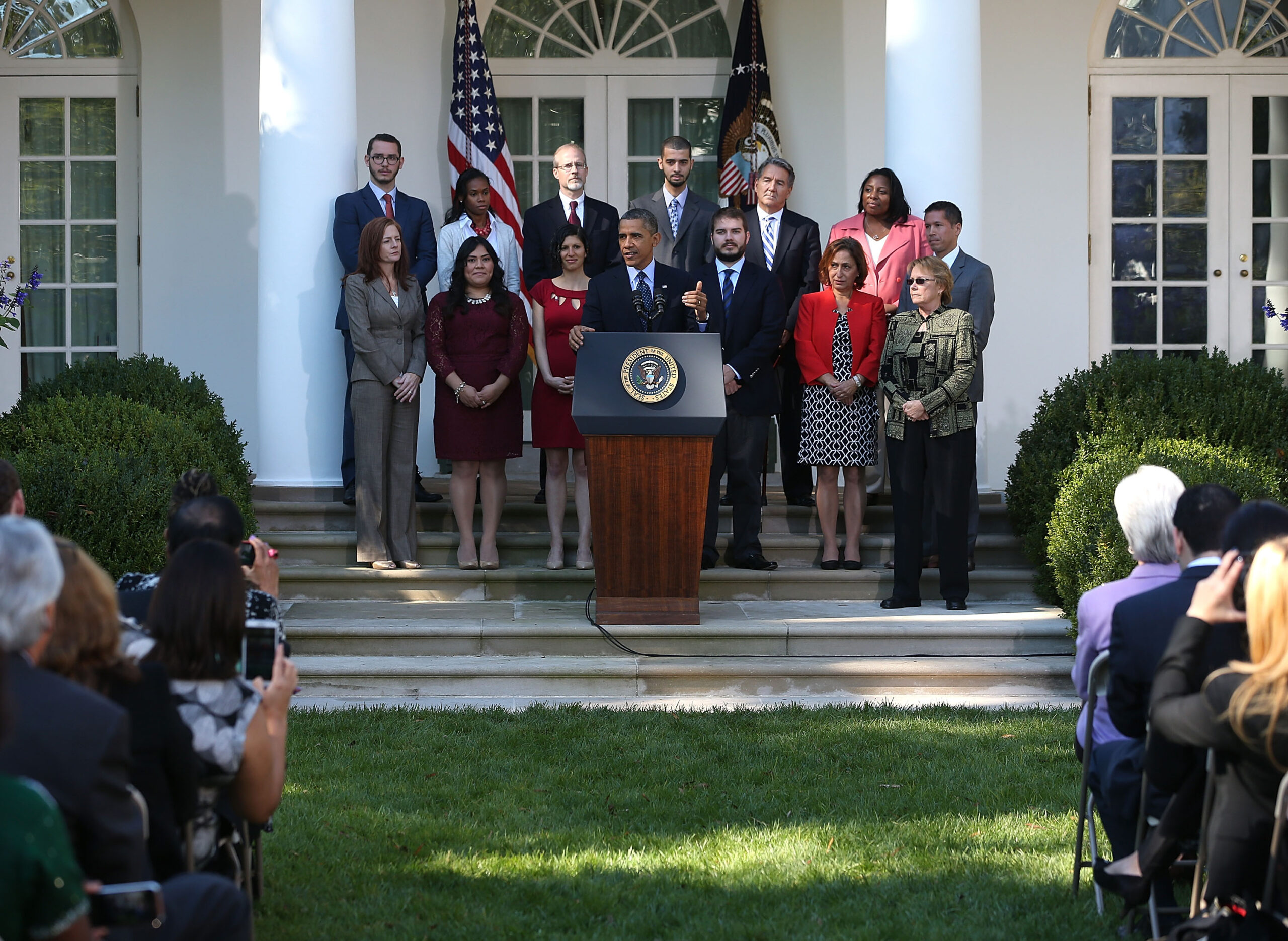 President leads a surreal pep rally for ailing Obamacare