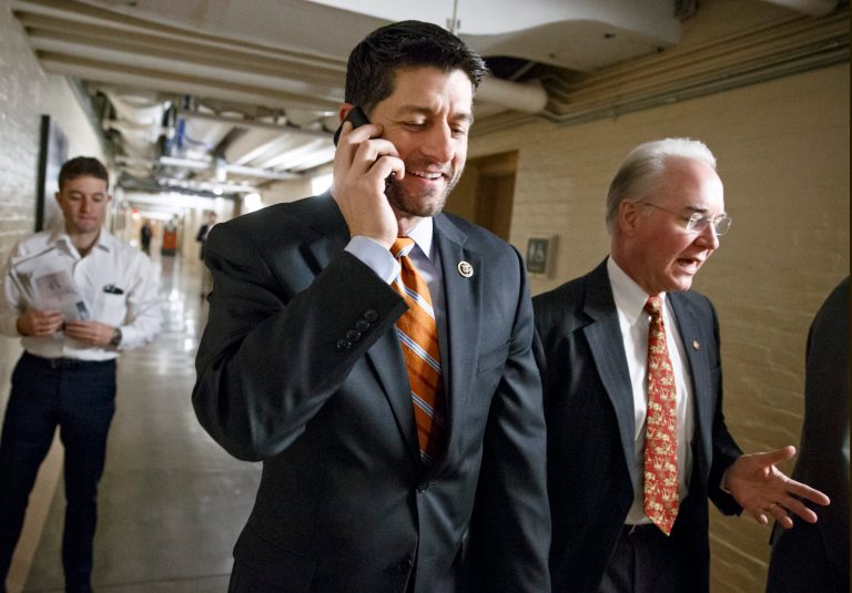 House Ways and Means Committee Chairman Rep. Paul Ryan, R-Wis., left, joined at right by Rep. Tom Price, R-Ga., heads to a meeting of House Republicans on Capitol Hill in Washington. (AP Photo/J. Scott Applewhite)