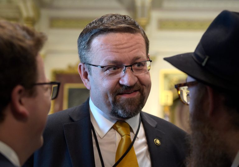 FILE - In this Tuesday, May 2, 2017 file photo, deputy assistant to President Trump, Sebastian Gorka, talks with people in the Treaty Room in the Eisenhower Executive Office Building on the White House complex in Washington during a ceremony commemorating Israeli Independence Day. White House national security aide Sebastian Gorka tells The Associated Press he has resigned from his position, Friday, Aug. 25, 2017. (AP Photo/Susan Walsh, File)