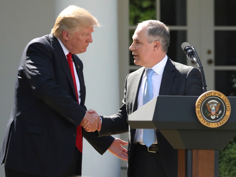 President Donald Trump in June shakes hands with EPA Administrator Scott Pruitt after speaking about the U.S. role in the Paris climate change accord in the Rose Garden of the White House in Washington. (AP Photo/Andrew Harnik)