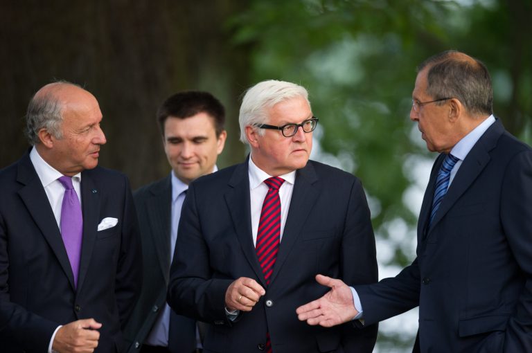 Foreign Ministers of France Laurent Fabius, Ukraine Pavlo Klimkin, Germany Frank-Walter Steinmeier and Russia Sergey Lavrov, from left, go for a walk before a meeting at the Guesthouse of Foreign Ministry Villa Borsig in Berlin, Sunday, Aug. 17, 2014. (AP Photo/Steffi Loos)