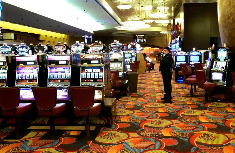FILE - In this May 13, 2008 file photo, one of the slot machine rooms at the new MGM Grand Hotel stands ready for the start of business at the Foxwoods Resort Casino in Mashantucket, Conn. The spread of casino gambling is reaping billions of dollars for industry and government coffers, but also is creating more compulsive gamblers. Advocates for treatment services point to gaps between the amount of money states receive and what they spend on compulsive gambling. In 2012, Connecticut's gambling industry generated almost $659 million in state revenue, while problem gambling services received $1.9 million. (AP Photo/Bob Child, File)