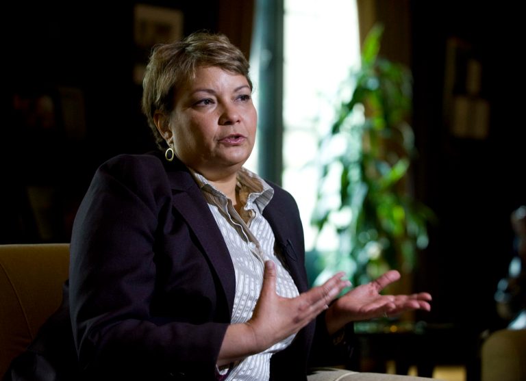   FILE- In this April 17, 2012 file photo, Environmental Protection Agency (EPA) Administrator Lisa Jackson gestures during an interview with The Associated Press at EPA Headquarters in Washington. In its first major regulation since the election, the Obama administration will impose a new air quality standard that reduces by 20 percent the maximum amount of soot released into the air from smokestacks, diesel trucks and other sources of pollution. The Environmental Protection Agency is set to announce the new standard on Friday, meeting a court deadline in a lawsuit by 11 states and public health groups. (AP Photo/Kevin Wolf, File)  