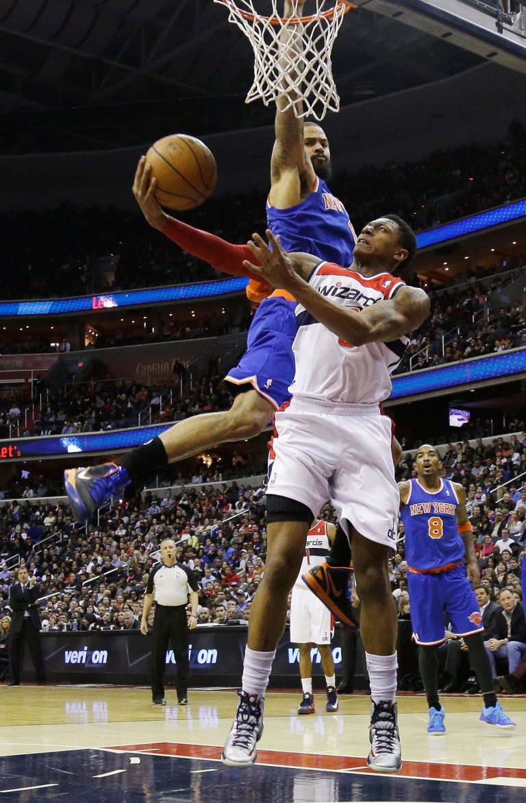 WASHINGTON, DC - MARCH 01: Bradley Beal #3 of the Washington Wizards shoots the ball in front Tyson Chandler #6 of the New York Knicks during the second half at Verizon Center on March 1, 2013 in Washington, DC. NOTE TO USER: User expressly acknowledges and agrees that, by downloading and or using this photograph, User is consenting to the terms and conditions of the Getty Images License Agreement.  (Photo by Rob Carr/Getty Images)