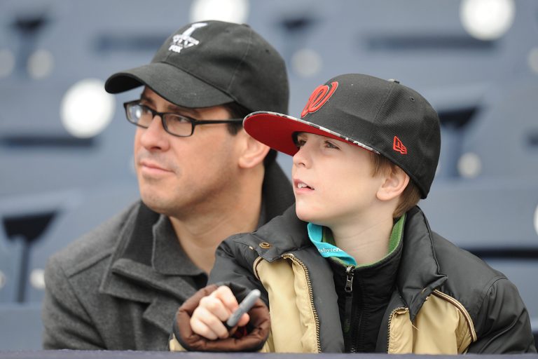 Father and son watch batting practice before during a baseball between Washington Nationals and the Atlanta Braves at Nationals Park on April 5, 2014 in Washington, D.C. (Photo by Mitchell Layton/Getty Images)