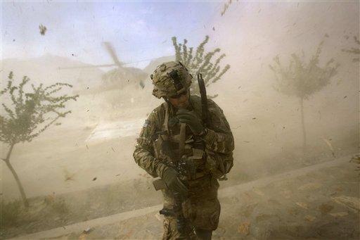 2nd Lt. Andrew Ferrara, 23, of Torrance, Calif., with the U.S. Army's Bravo Company of the 25th Infantry Division, 3rd Brigade Combat Team, 2nd Battalion 27th Infantry Regiment, based in Schofield Barracks, Hawaii, turns from the rotor wash of a landing Blackhawk helicopter during a mission for a key leader engagement at the Shigal district center Thursday, Sept. 15, 2011 in Kunar province, Afghanistan. (AP Photo/David Goldman)