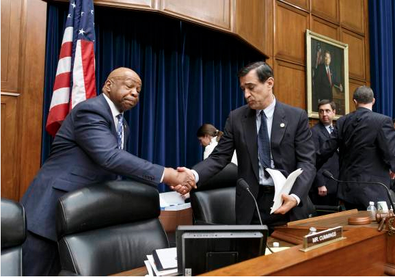 House Oversight Committee Chairman Rep. Darrell Issa, R-Calif., center, shakes hands with Rep. Elijah Cummings, D-Md., left, the ranking member on Capitol Hill in Washington, Thursday, April 10, 2014. (AP Photo/J. Scott Applewhite)