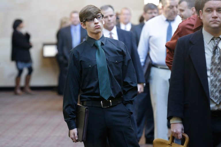 Austin Moore, 18, lines up with other job seekers during a career fair at a hotel in Dallas. (AP/LM Otero)