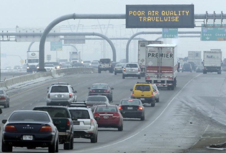 FILE - This Jan. 23, 2013, file photo, shows a poor air quality sign is posted over a highway, in Salt Lake City. Carbon dioxide levels in the atmosphere reached a record high in 2013 as increasing levels of man-made pollution transform the planet, the U.N. weather agency said Tuesday, Sept. 9, 2014. (AP Photo/Rick Bowmer, File)