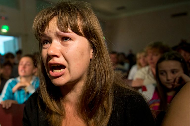 A woman from Ukraine cries at a meeting with OSCE's secretary-general Lamberto Zannier at a  camp for refugees from the conflict in Ukraine's east, in the village of Dmitriadovka near Rostov-on-Don, southern Russia, Thursday, June 12, 2014. The OSCE's secretary-general on Thursday visited a camp in Russia for refugees from the conflict in Ukraine's east and called for the fighting to end. (AP Photo/Mikhail Mordasov)