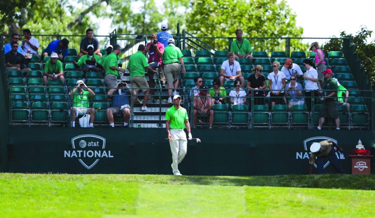 Rob Carr/Getty Images
Tiger Woods played with almost no gallery Saturday, when fans were barred from Congressional after it was ravaged by storms.