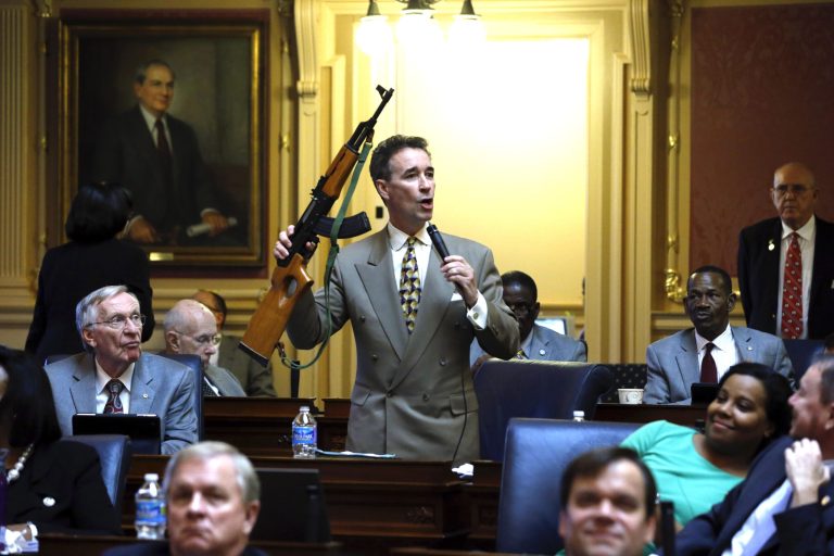 Del. Joe Morrissey, D-Henrico, holds up an AK47-style rifle as he speaks for more control on such weapons during a floor speech to the Virginia House of Delegates at the State Capitol in Richmond, Va. Thursday, Jan. 17, 2013. (AP Photo/Richmond Times-Dispatch, Bob Brown)