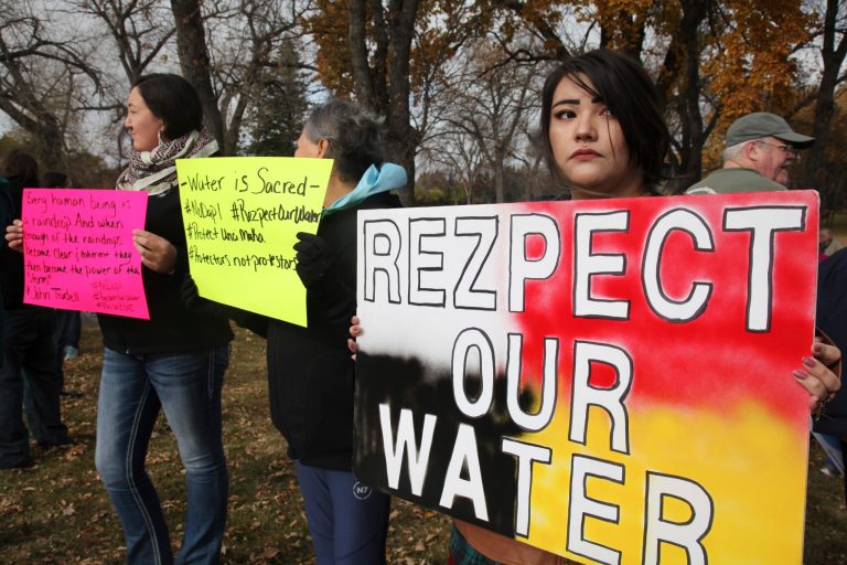 Protesters are urging Facebook users to create a virtual smokescreen to prevent local law enforcement from targeting activists trying to block the controversial Dakota Access oil pipeline in North Dakota. (AP Photo/ John L. Mone)