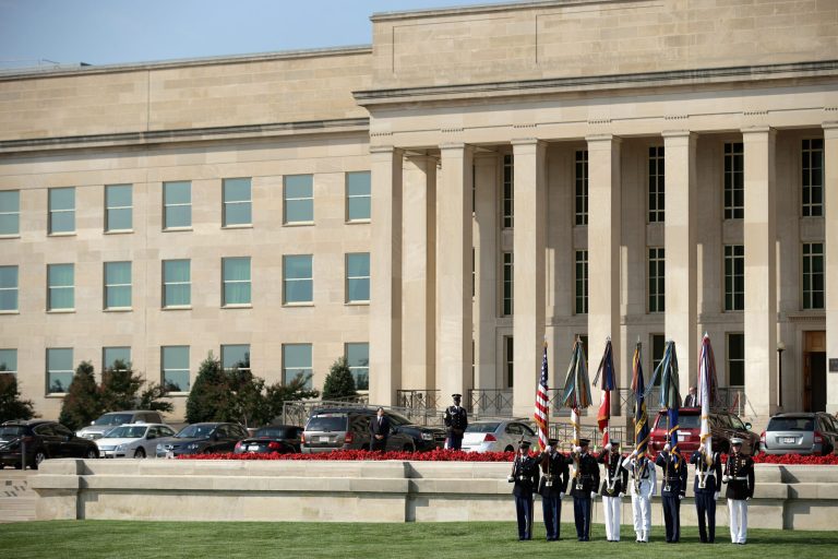 Members of a United States military honor guard prepare to march in the colors during the Defense Department's National POW/MIA Recognition Day Ceremony on the Pentagon River Terrace Parade Field September 19, 2014 in Arlington, Va. (Photo by Chip Somodevilla/Getty images