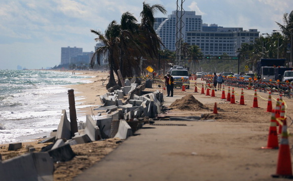 FORT LAUDERDALE, FL - NOVEMBER 27:  Cones mark off the damage caused by beach erosion along route A-1-A, making parts of it impassable to vehicles on November 27, 2012 in Fort Lauderdale, Florida. The beach was eroded away last month when Hurricane Sandy passed by to the east and now City officials are saying that the damage may preview what rising sea levels can mean for coastal communities throughout South Florida. Climate scientists predict sea levels in South Florida will rise by 1 foot by 2070, 2 feet by 2115, and 3 feet by 2150.  (Photo by Joe Raedle/Getty Images)