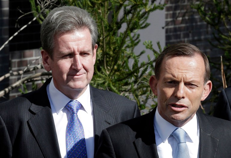 FILE - In this Aug. 19, 2013 file photo, Australia's opposition leader Tony Abbott, right, with New South Wales Premier Barry O'Farrell speaks to the media in St. Marys, an outer suburb of Sydney, Australia during his election campaign. O'Farrell, the leader of Australia's most populous state, quit as premier on Wednesday, April 16, 2014 in the face of mounting evidence that he failed to declare a 3,000 Australian dollar ($2,800) bottle of wine that arrived as a gift on his Sydney doorstep. (AP Photo/Rob Griffith, File)