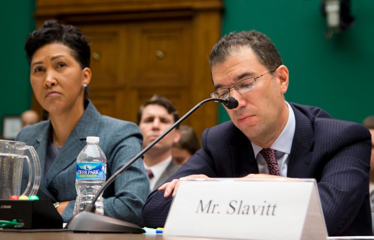 From left, Campbell, Andrew Slavitt, group executive vice president for Optum/QSSI, and Lynn Spellecy, corporate counsel for Equifax Workforce Solutions. (AP/ Evan Vucci)
