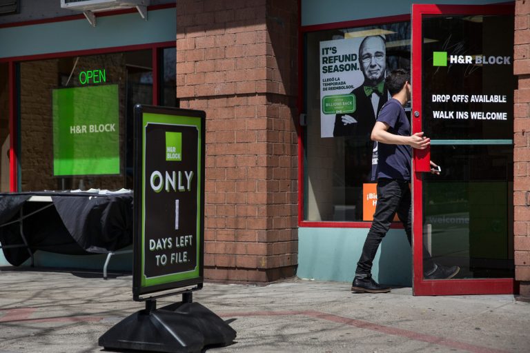 A man walks into an H&R Block on April 15, 2015 in New York City. April 15 is the deadline for filing federal income taxes. (Photo by Andrew Burton/Getty Images)