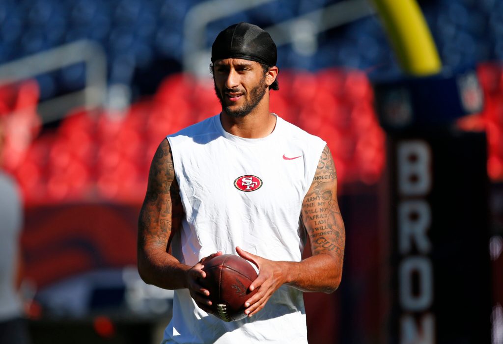 NFL quarterback Kaepernick refuses to stand during national anthem