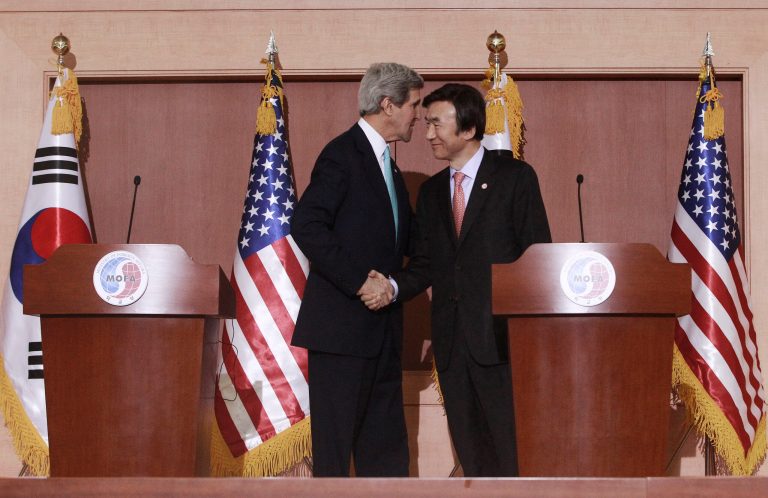 U.S. Secretary of State John Kerry, left, shakes hands with South Korean Foreign Minister Yun Byung-se at the end of their press conference at the Foreign Ministry in Seoul, South Korea, Thursday, Feb. 13, 2014. Kerry is on his fifth trip to Asia on a mission aimed largely at easing tensions between China and its smaller neighbors over territorial disputes and exploring ways to restart long-stalled multi-party talks on ridding North Korea of nuclear weapons. (AP Photo/Ahn Young-joon)