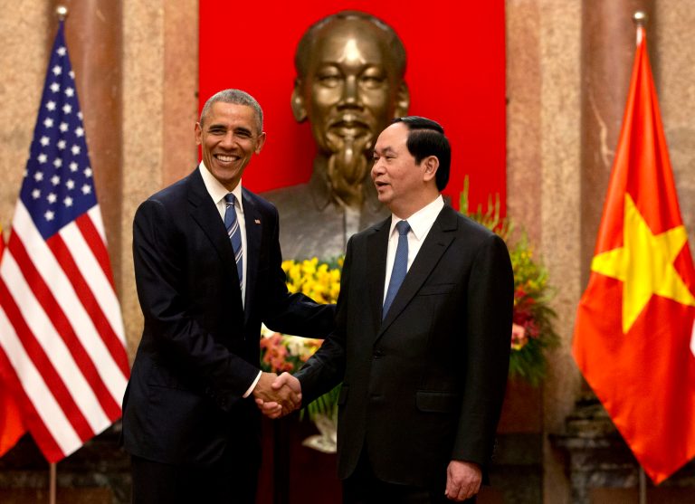 President Barack Obama and Vietnamese President Tran Dai Quang shake hands at the Presidential Palace in Hanoi, Vietnam, on Monday. Obama said the U.S. Peace Corps would soon be operating in Vietnam. (AP Photo/Carolyn Kaster)