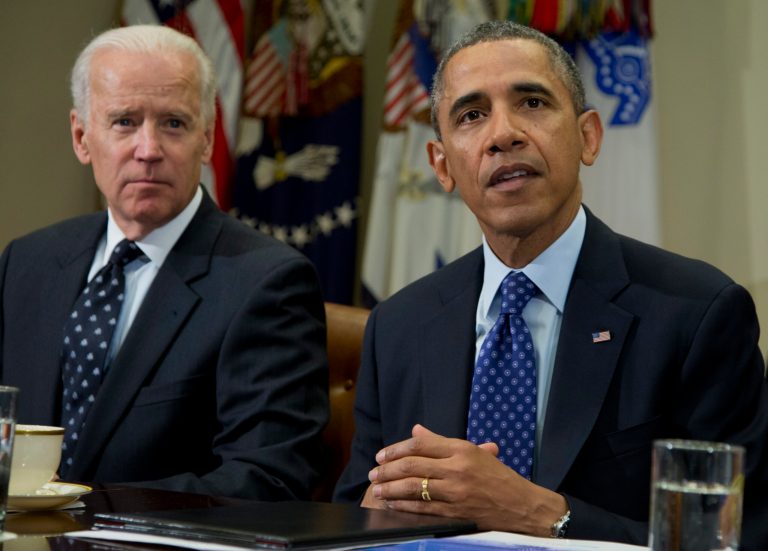 Vice President Joe Bide listens as President Barack Obama speaks to the media as they meet with the Presidential Commission on Election Administration, Wednesday, Jan. 22, 2014, in the Roosevelt Room of the White House in Washington. The Commission was created to identify non-partisan ways to shorten lines at polling places, promote the efficient conduct of elections, and provide better access to the polls for all voters. (AP Photo/Carolyn Kaster)