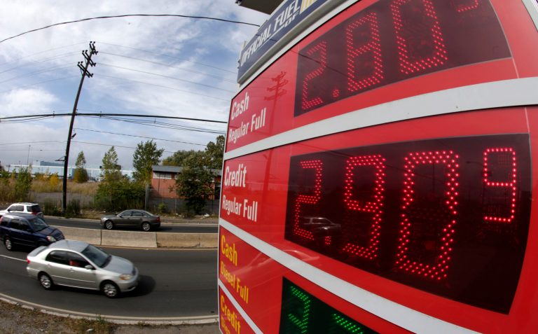 Gas prices below $3 dollars are displayed at a gas station, Wednesday, Oct. 15, 2014, in Jersey City, N.J. A sudden plunge in the price of oil is sending economic and political shockwaves around the world as oil exporting countries face the prospect of trillions of dollars of lost revenue and importing nations get some relief in a time of slower economic growth.  (AP Photo/Julio Cortez)
