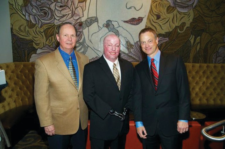 Courtesy of Tim Lundin 
From left, Longboard Hospitality Group President  Larry Work, Army veteran Michael Schlitz and actor Gary Sinise.